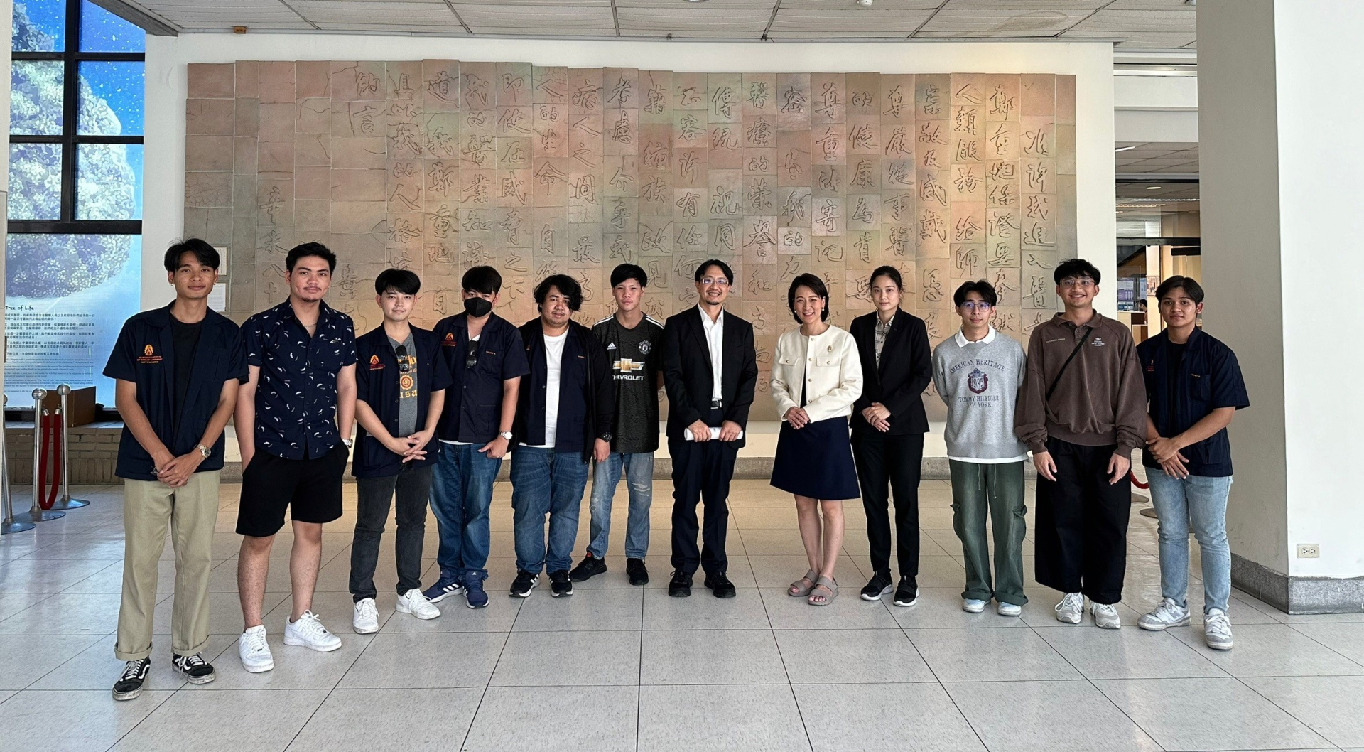 Fig #5.  KMITL delegation in front of the Hippocratic Oath at the Faculty of Medicine, NCKU with Professor Chia-Ching Wu